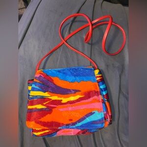 Multi colored shoulder purse. No brand name